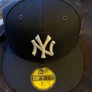 Never Worn: NY Yankees fitted baseball cap.